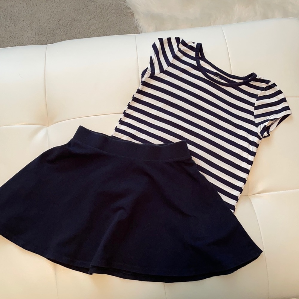 Girls two piece set. Navy blue striped shirt with navy blue skirt.